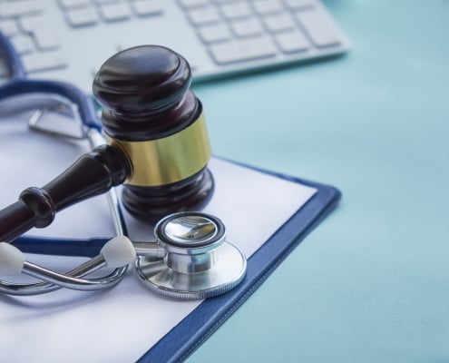 Gavel and stethoscope. medical jurisprudence. legal definition of medical malpractice. attorney. common errors doctors, nurses and hospitals make