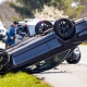 Vehicle rollover highway road accident with police in the back