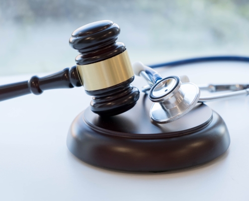 Gavel and stethoscope. medical jurisprudence. legal definition of medical malpractice. attorney. common errors doctors, nurses and hospitals make.