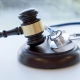 Gavel and stethoscope. medical jurisprudence. legal definition of medical malpractice. attorney. common errors doctors, nurses and hospitals make.