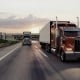 American style truck on freeway pulling load. Transportation theme. 3D illustration