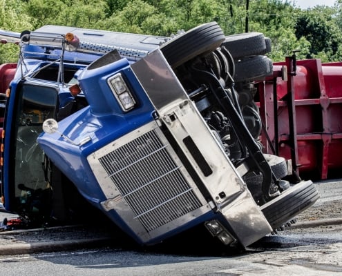 Due to their high center of gravity, semi-trucks can roll over easily.