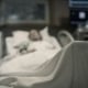 Sick woman lying in the hospital bed.