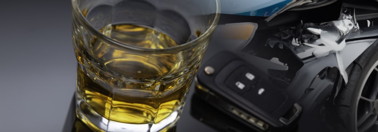 a glass of alcohol, a car key and a crashed car. Do not drive under the influence of alcohol