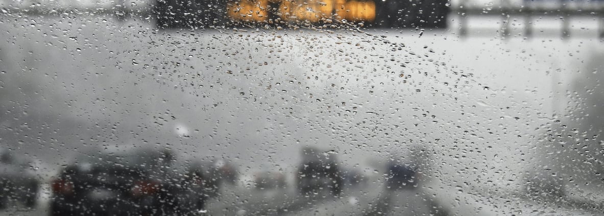 hazardous weather condition on the road seen through windshield