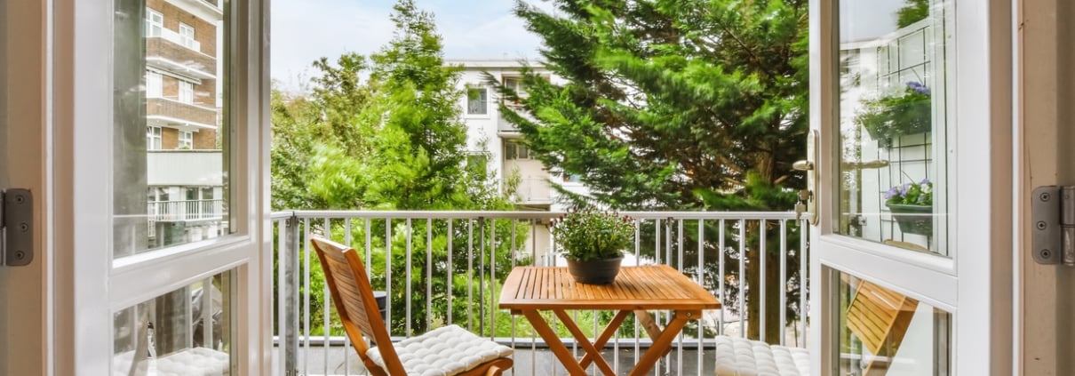 A beautiful image of a tiny outdoor balcony with a green view; design ideas