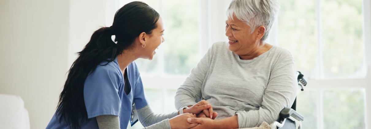 Happy woman, doctor and senior patient in wheelchair, support or trust for healthcare advice at old age home. Medical nurse, caregiver or person with a disability smile for care or help at house