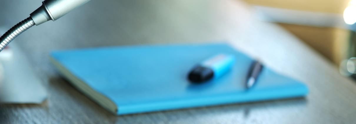 Communication, media or news concept: Detail of a modern silver microphone in a board, conference room or office, selective focus, copy space, close-up