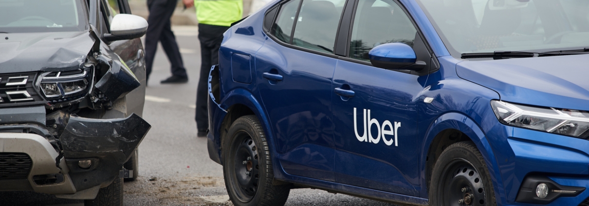 Bucharest, Romania - March 02, 2023: An Uber logo branded car on the road at the place where it was involved in a car accident. This image is for editorial use only.