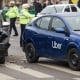 Bucharest, Romania - March 02, 2023: An Uber logo branded car on the road at the place where it was involved in a car accident. This image is for editorial use only.