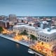 Wilmington, North Carolina, USA cityscape over the Cape Fear and Wilmington Riverwalk at dusk.