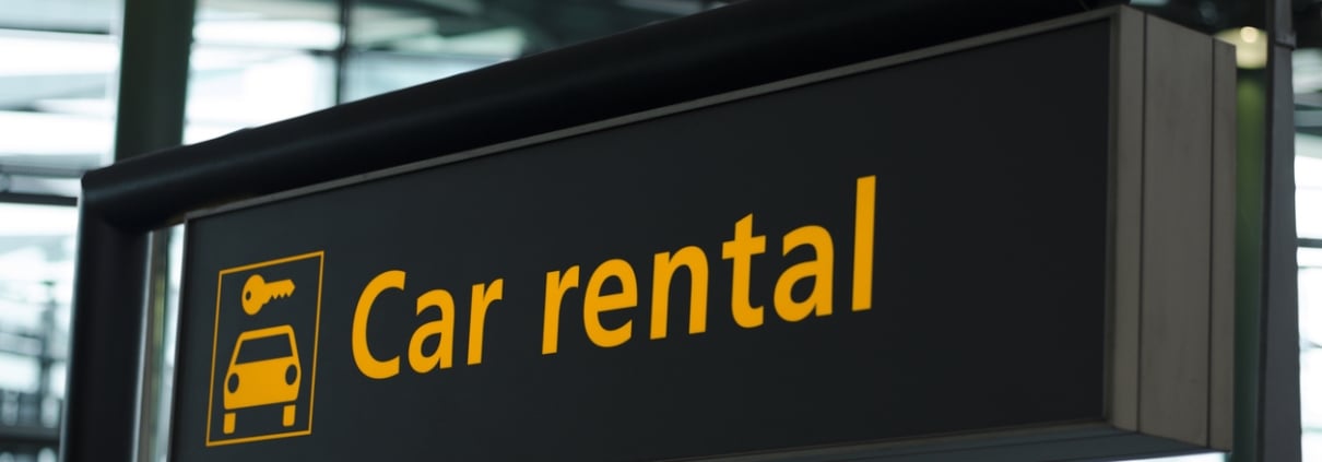 Sign with direction to car rental