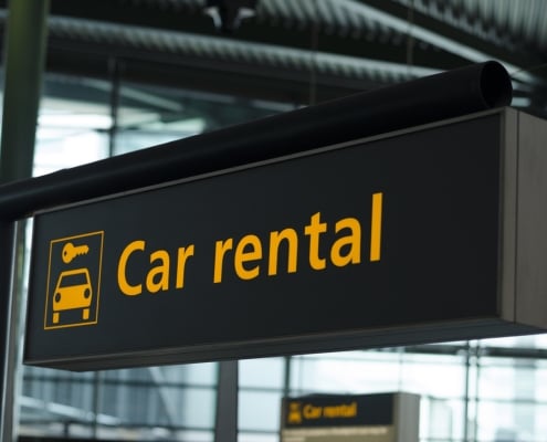 Sign with direction to car rental