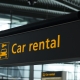 Sign with direction to car rental