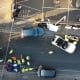 Car accident between two cars seen in aerial view.