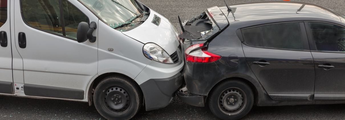 Auto accident involving two cars on a city street