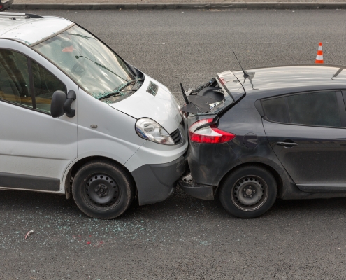 Auto accident involving two cars on a city street