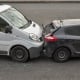 Auto accident involving two cars on a city street