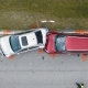 Car crash with two vehicles collided at traffic accident site on American street.