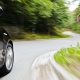 Motion blur of a car speeding towards the junction with Stop sign