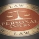 Personal injury written with golden letters over red and black background. Law concept. 3D illustration.